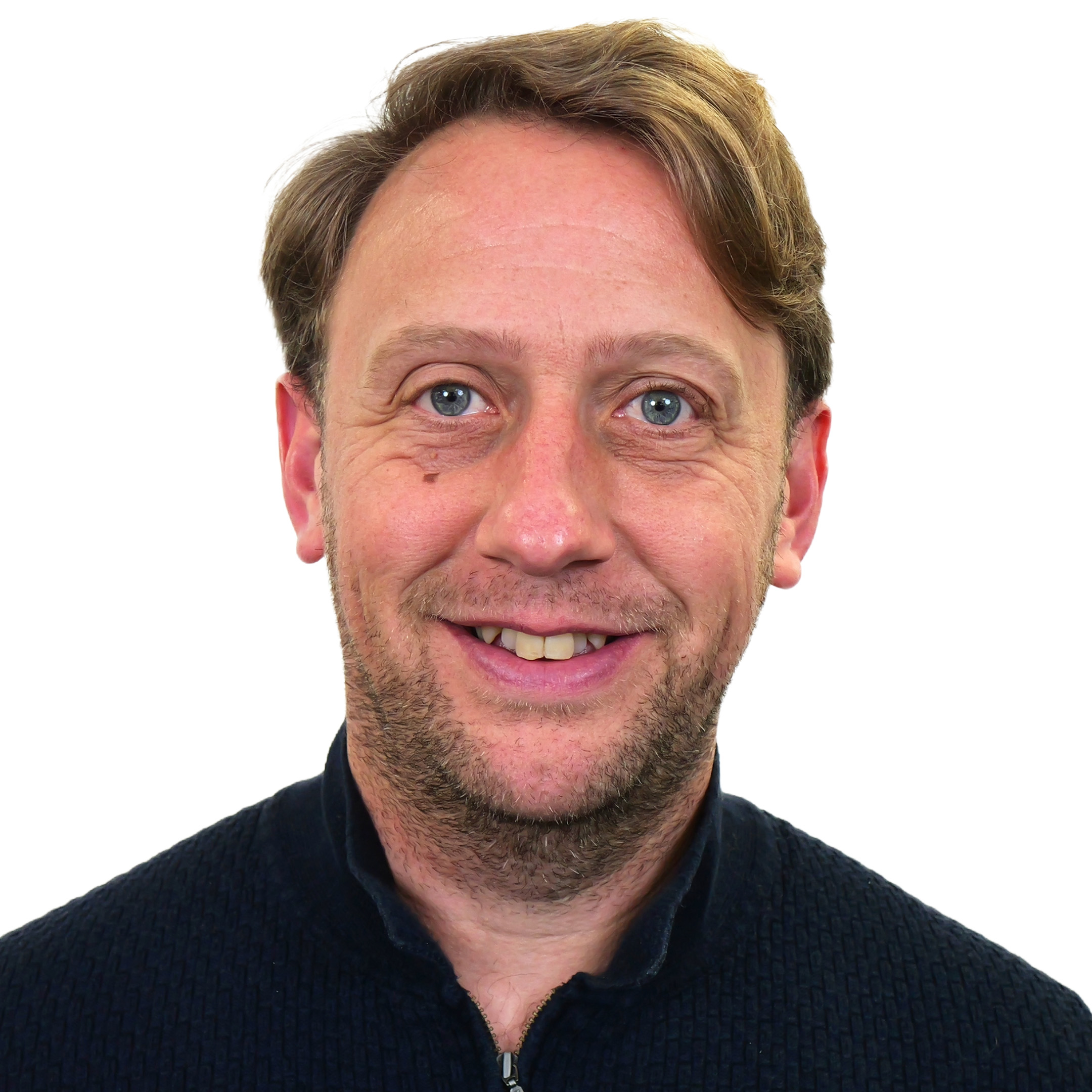 Darren Newbold (TMS) smiling in a white background.