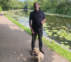 Man with Dog in Pond