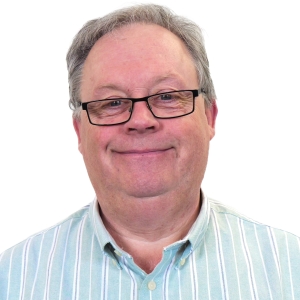 Phil Cook (TMS) smiling in a white background.