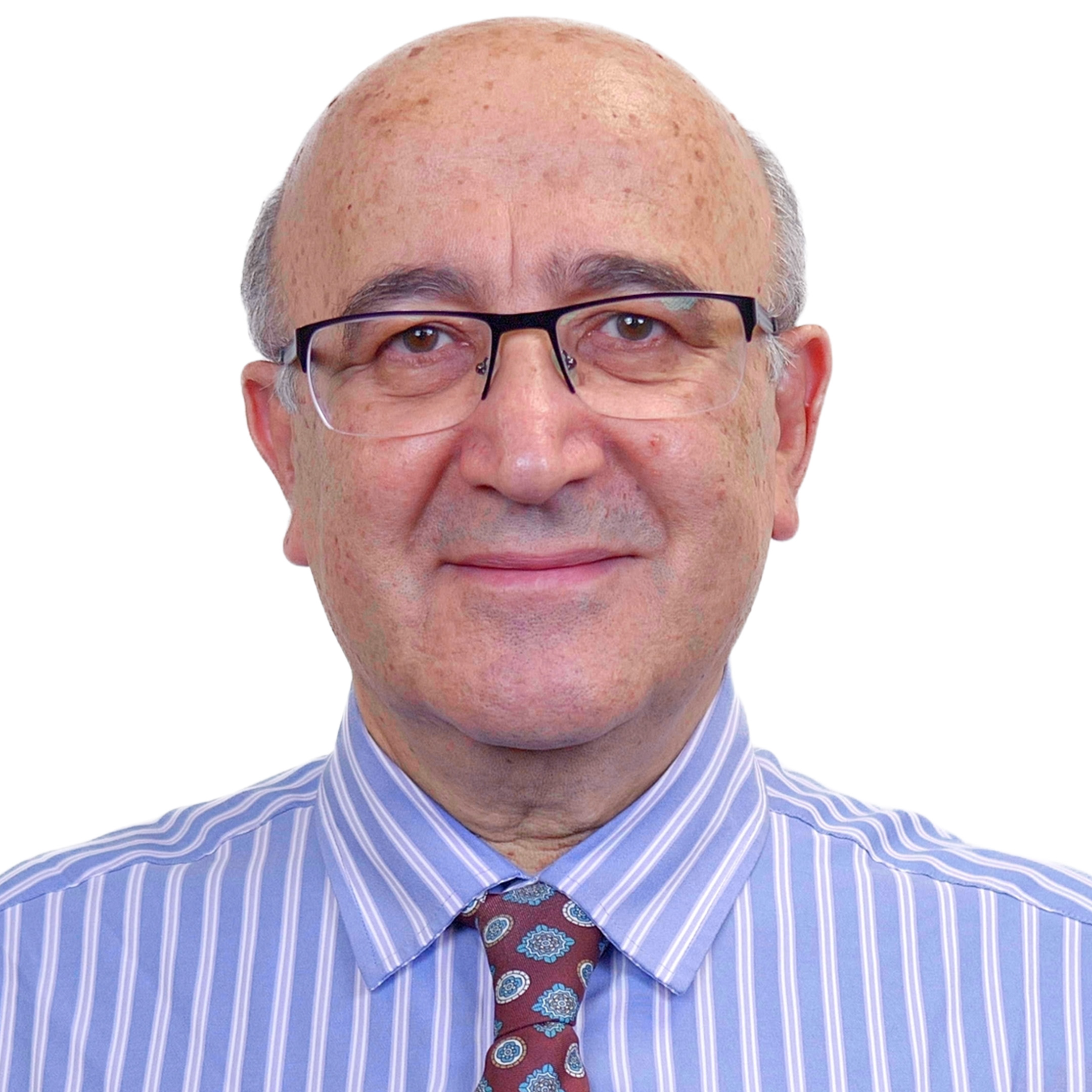 Reza Ahadi (TMS) smiling in a white background.