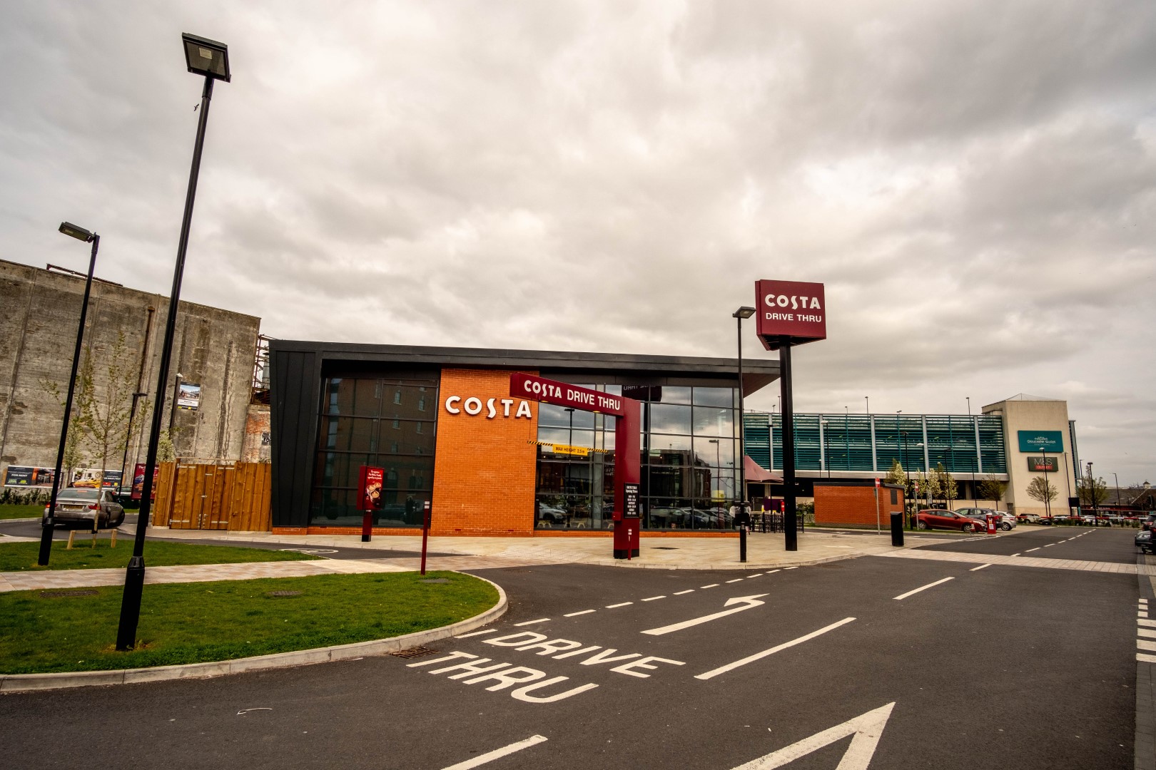 Shop front of a costa coffee store in a retail park, that has a drive through.