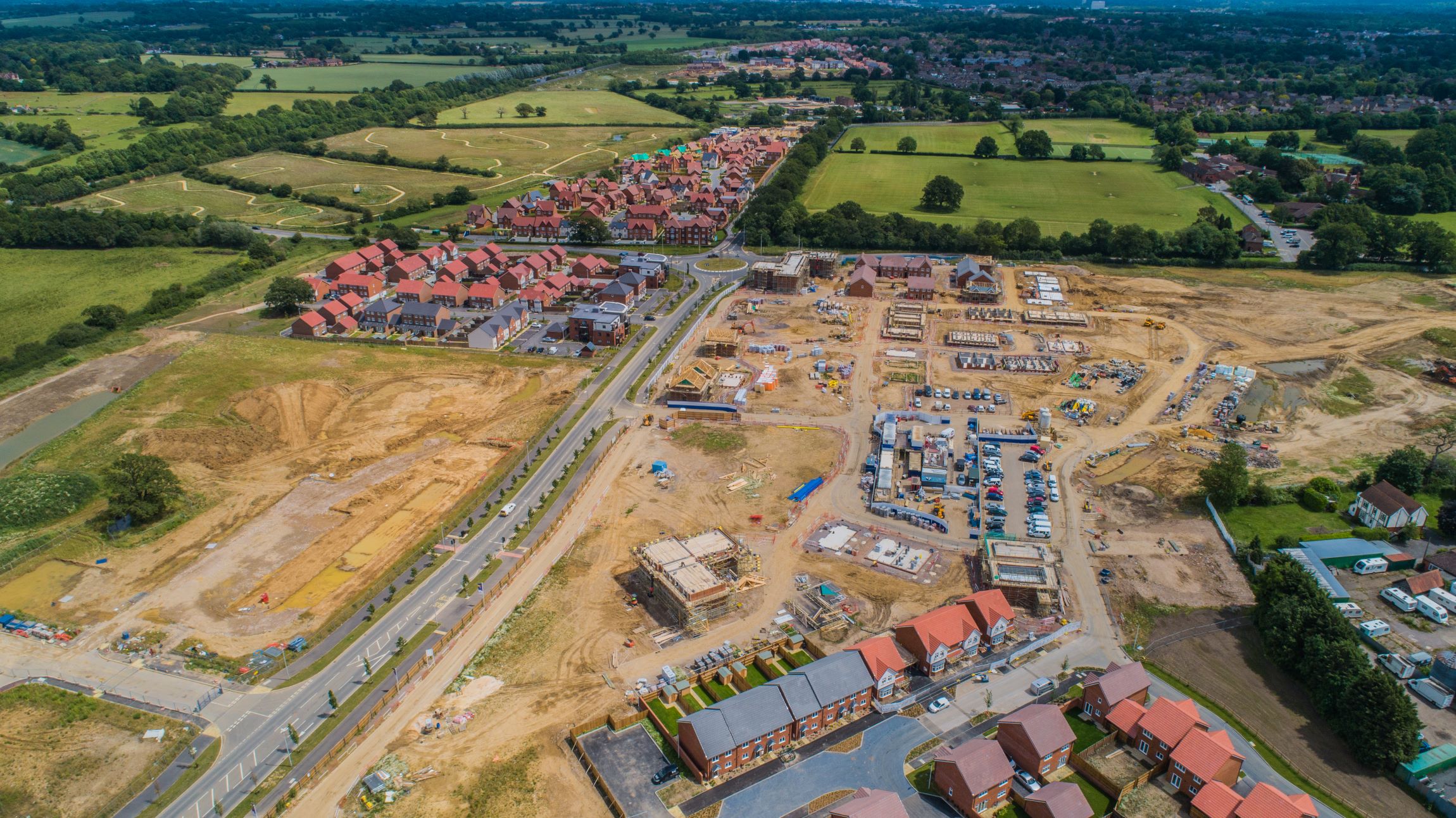 Aerial view of a large housing development construction site in the country side.