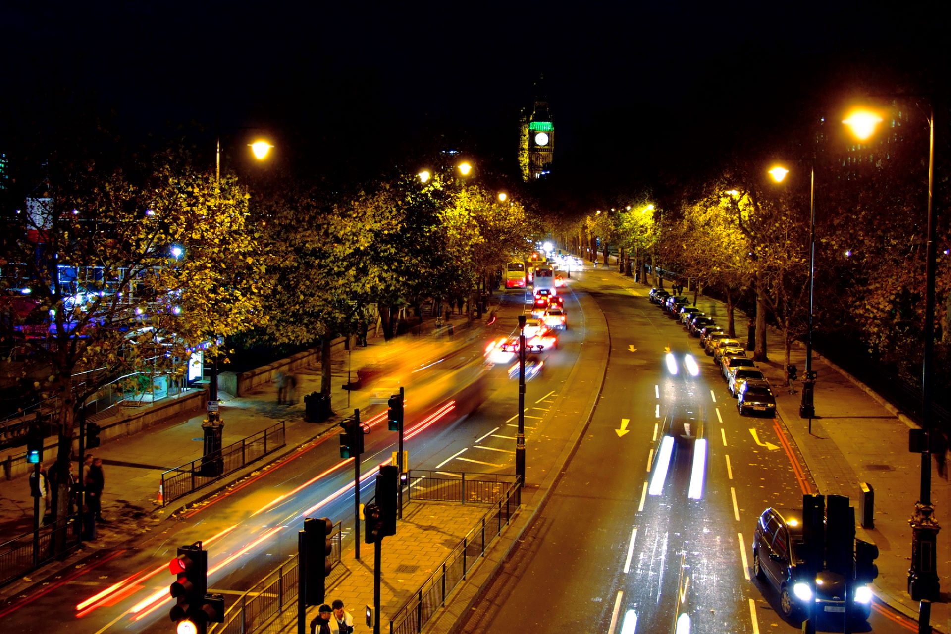 A view of the traffic in Westminster at night time.