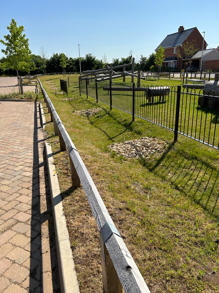 swale drainage near playground, new houses, SuDS