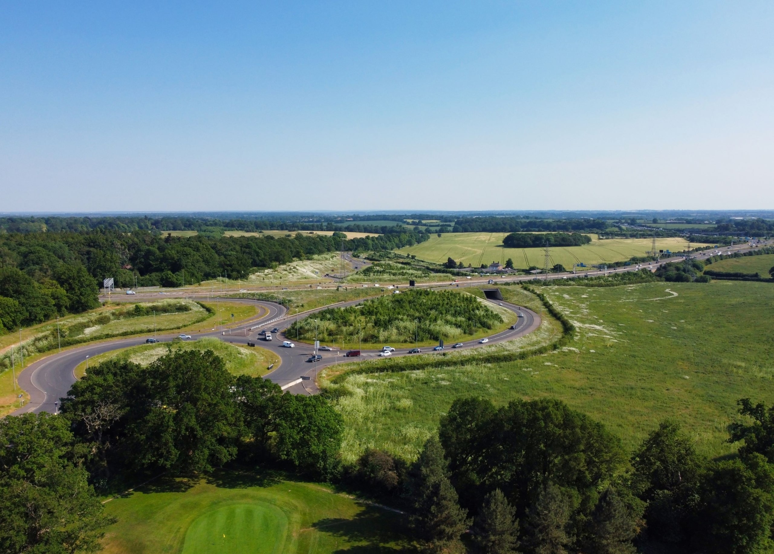 A bird's-eye view of a roundabout forming part of the external roads near Luton airport.