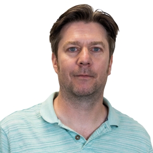 Mike Fuller (TMS) smiling in a white background.