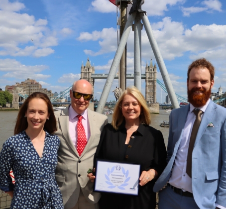 Jess Waldron (TMS), Steve Proctor (TMS), Tara Jowett (TMS) and Richard Cook (TMS) behind tower bridge and holding an award.