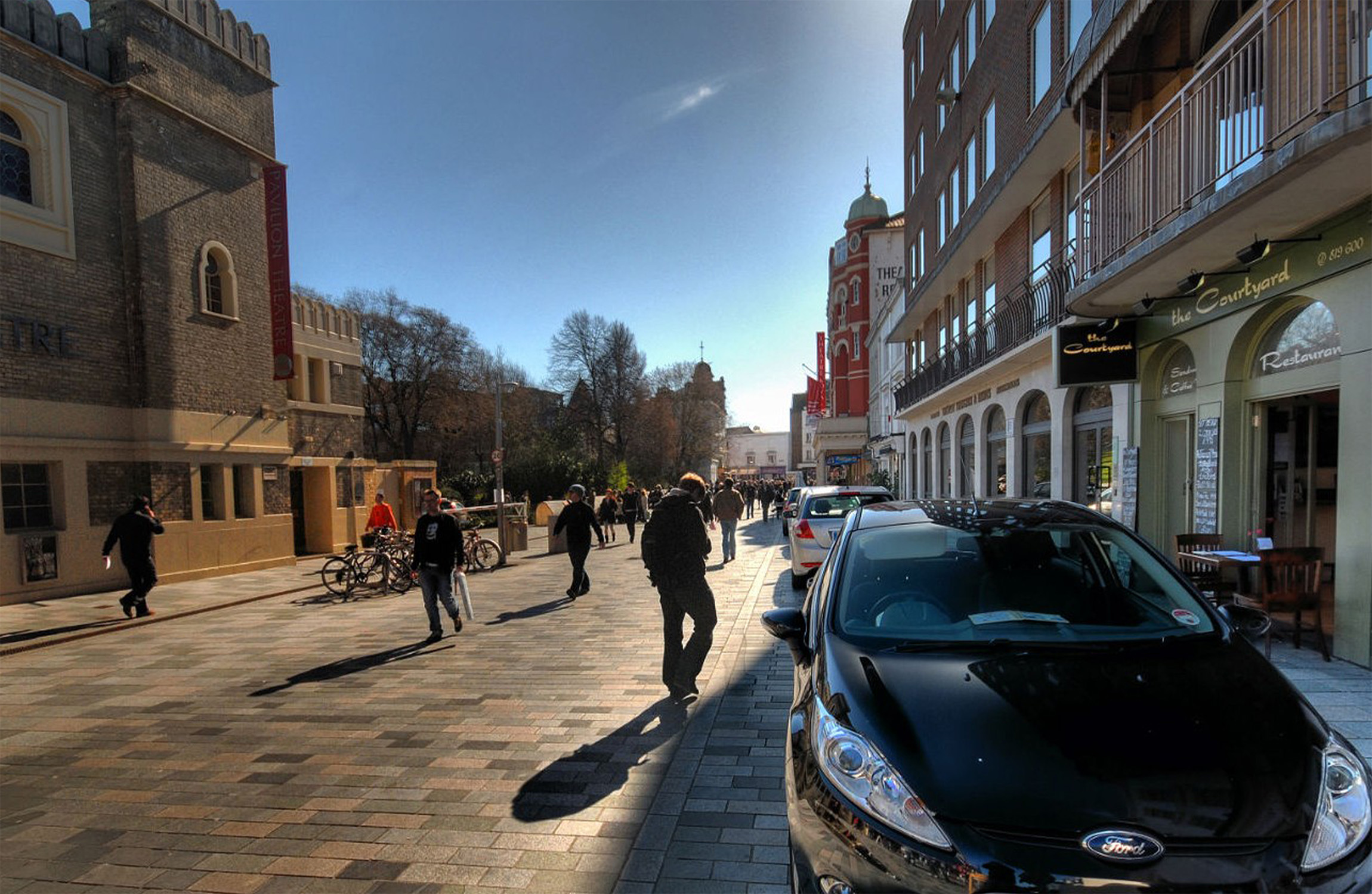 People walking in a busy street.