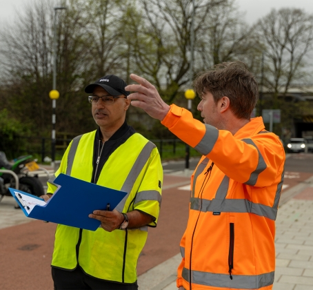 Hammy Aulak (TMS) and Mike Fuller (TMS) observing a road.