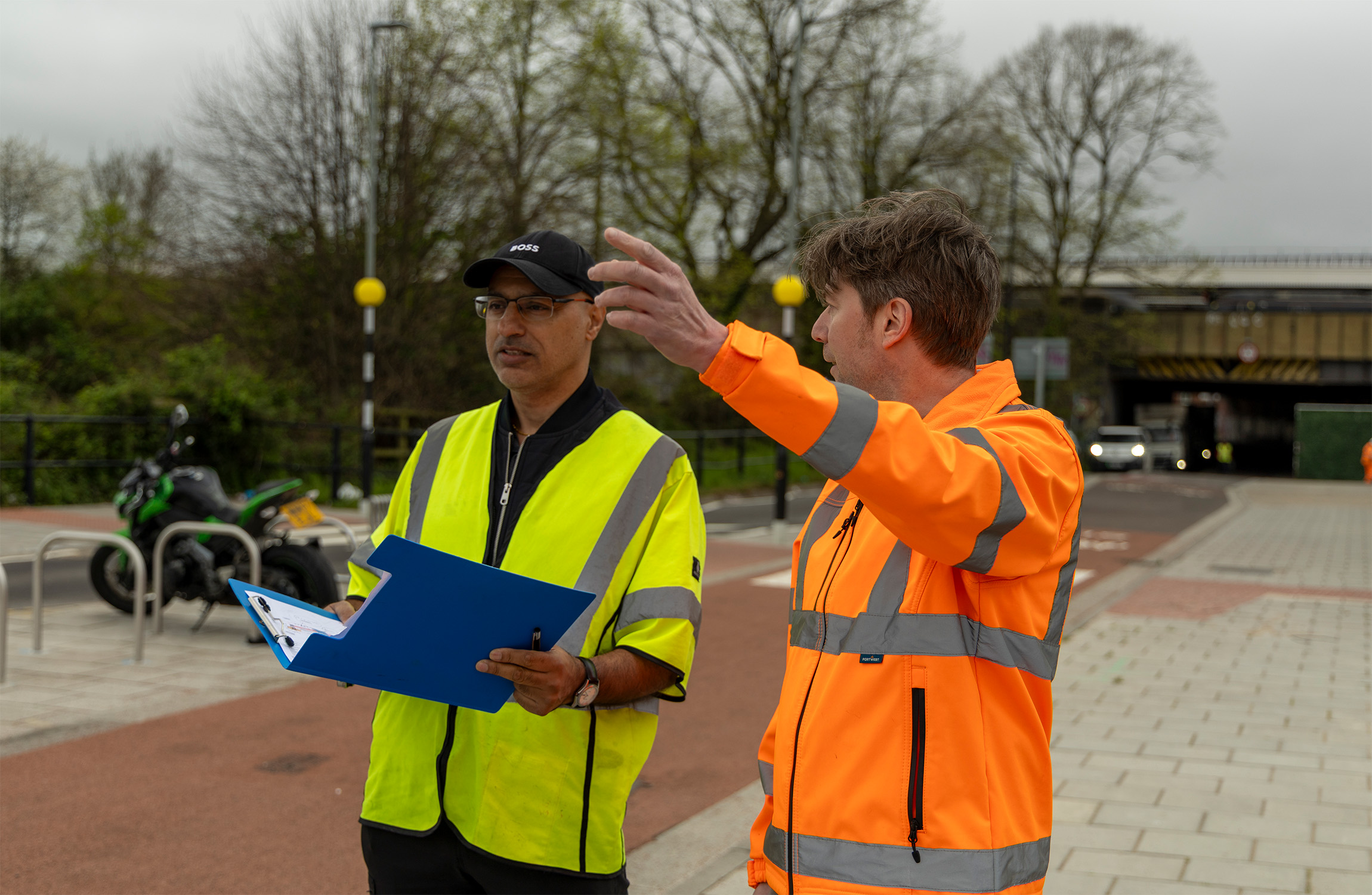 Hammy Aulak (TMS) and Mike Fuller (TMS) observing a road.