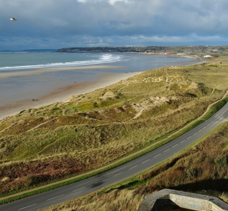 Road in Jersey with the beach in the background.
