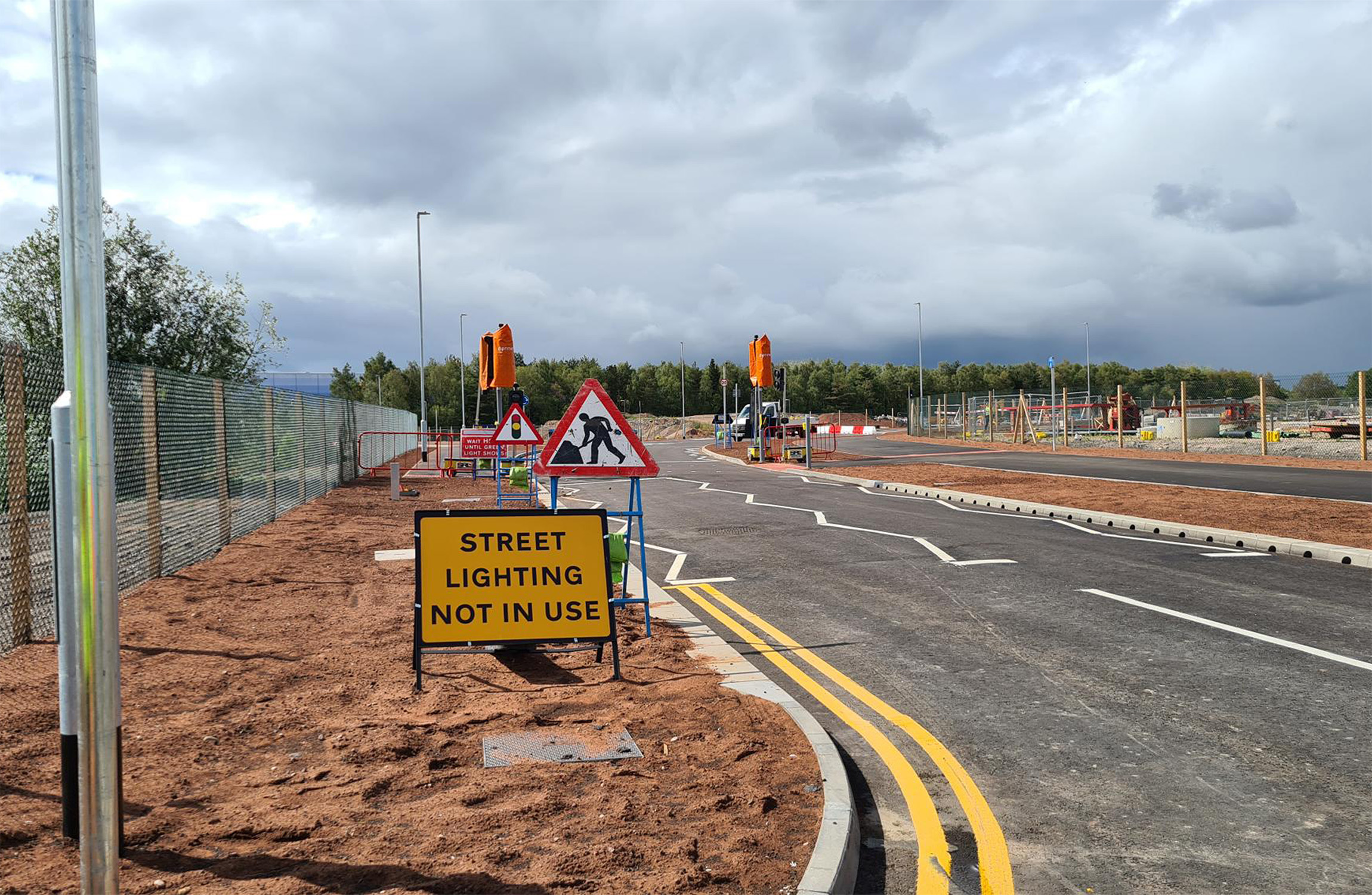 Building site at former Rugeley powerstation with temporary traffic management signs.