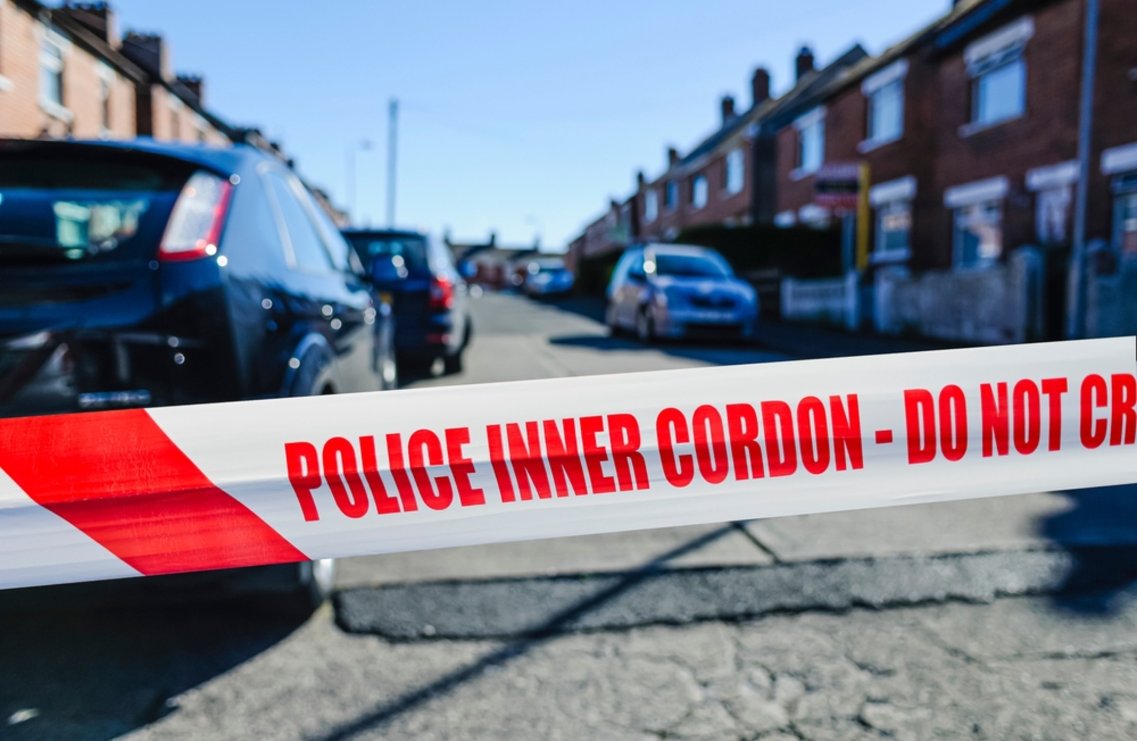 Police tape in across the road.